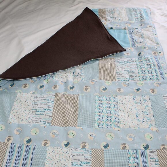 Homemade blue themed quilted baby blanket back is grey fleece. - Picture 4 of 5